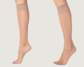 Women’s legs with support stockings to prevent venous insufficiency